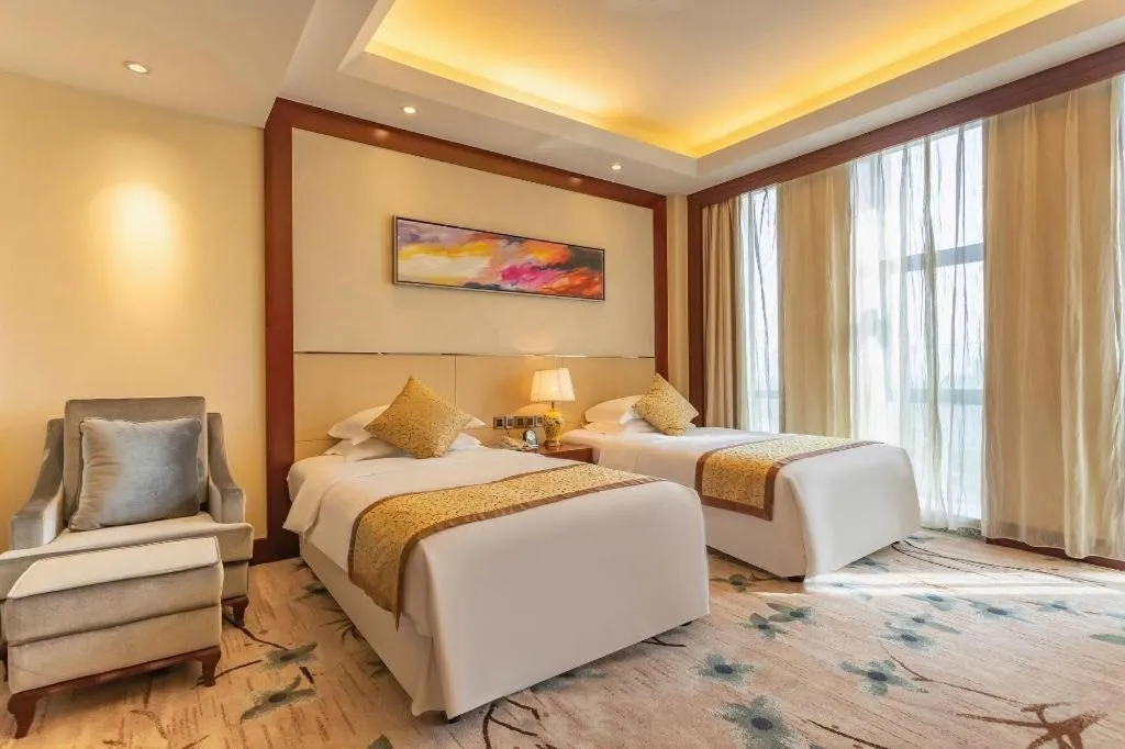 Bed in Dezhou Regal Kangbo Hotel