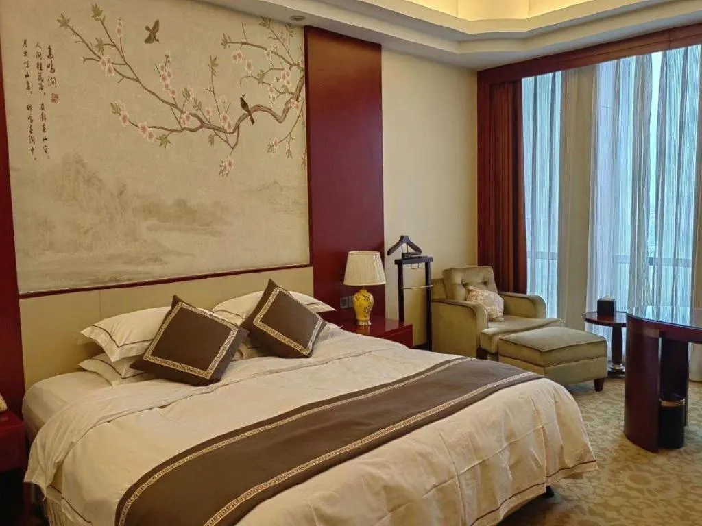 Bed in Dezhou Regal Kangbo Hotel