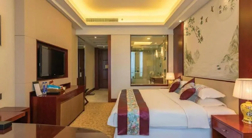 Bed in Dezhou Regal Kangbo Hotel