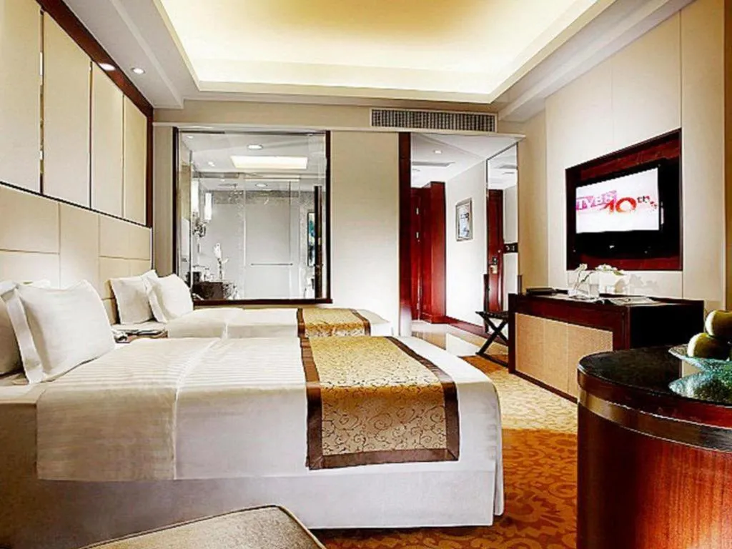 Bed in Dezhou Regal Kangbo Hotel