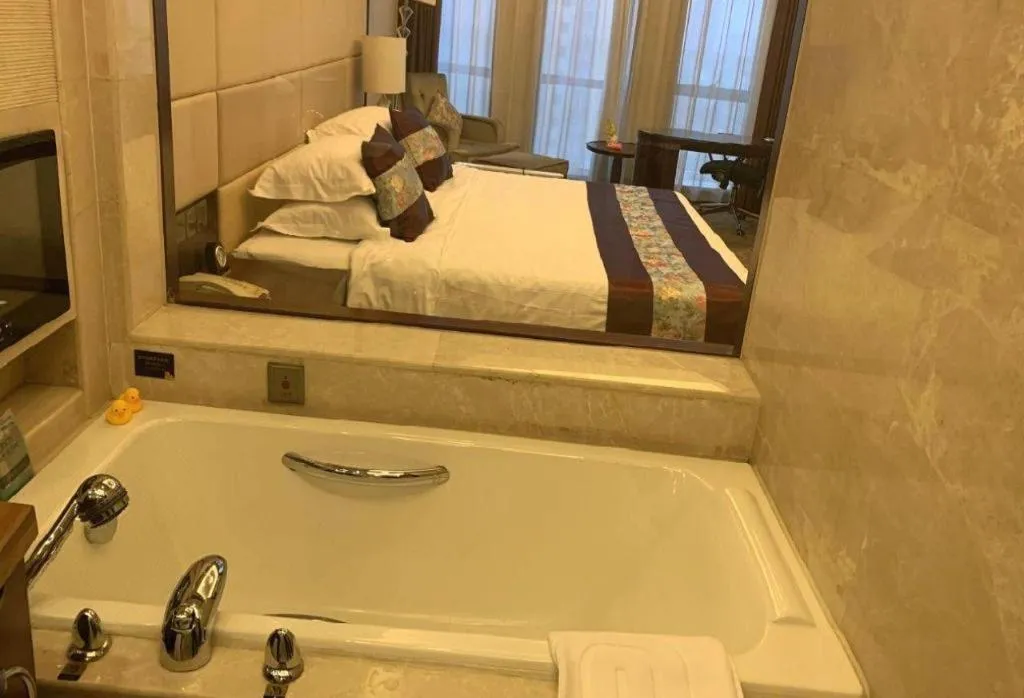 Bed in Dezhou Regal Kangbo Hotel