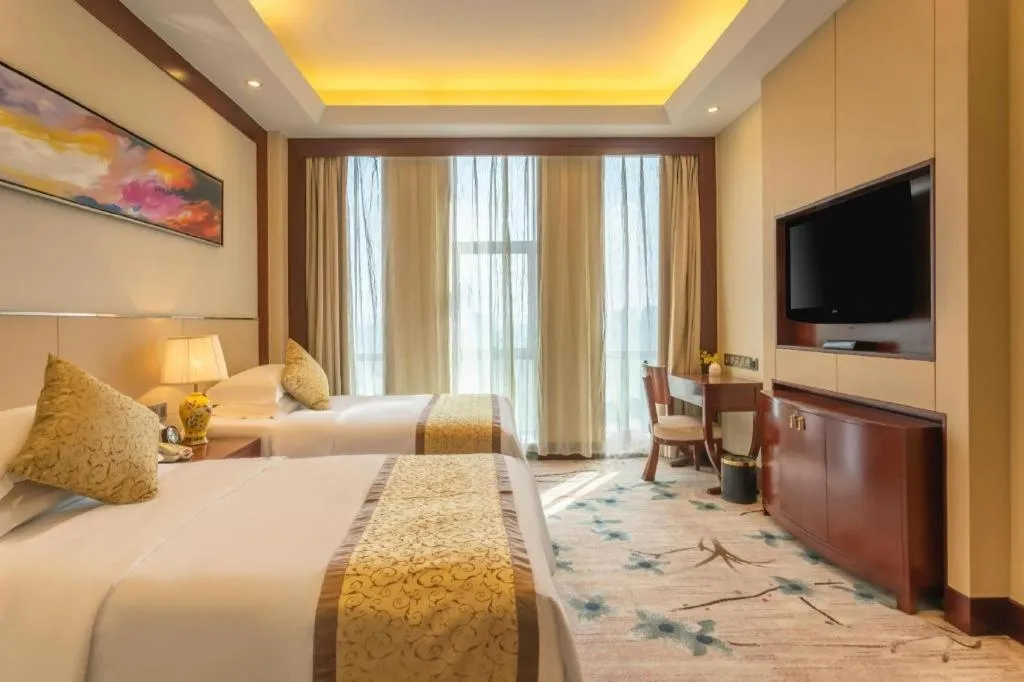 Bed in Dezhou Regal Kangbo Hotel