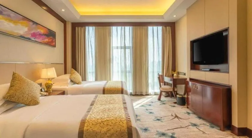 Bed in Dezhou Regal Kangbo Hotel