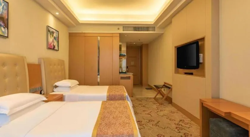 Bed in Dezhou Regal Kangbo Hotel