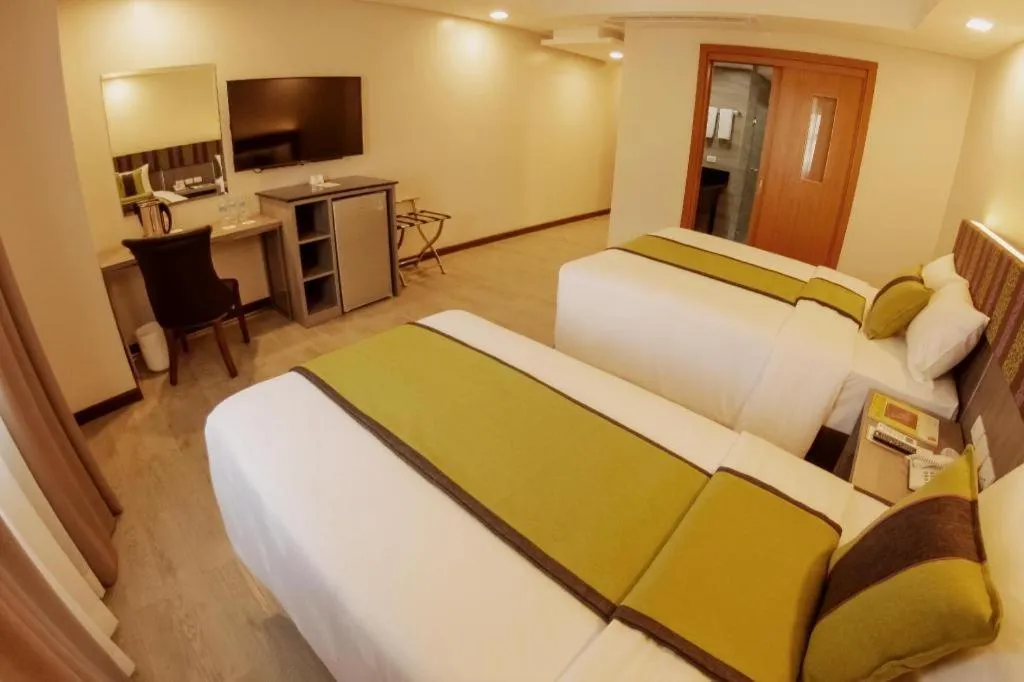 Bed in Grand Xing Imperial Hotel