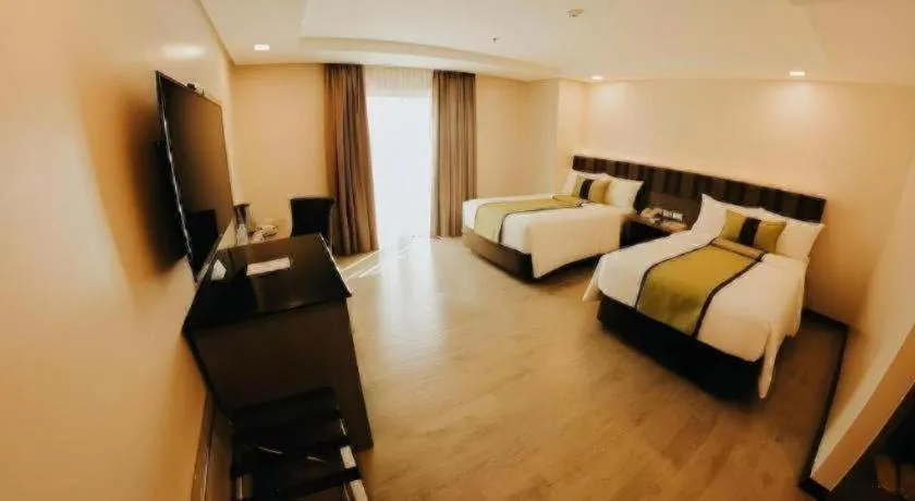 Bed in Grand Xing Imperial Hotel