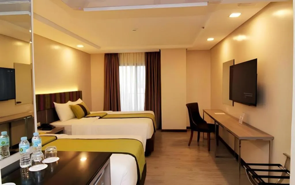 Bed in Grand Xing Imperial Hotel