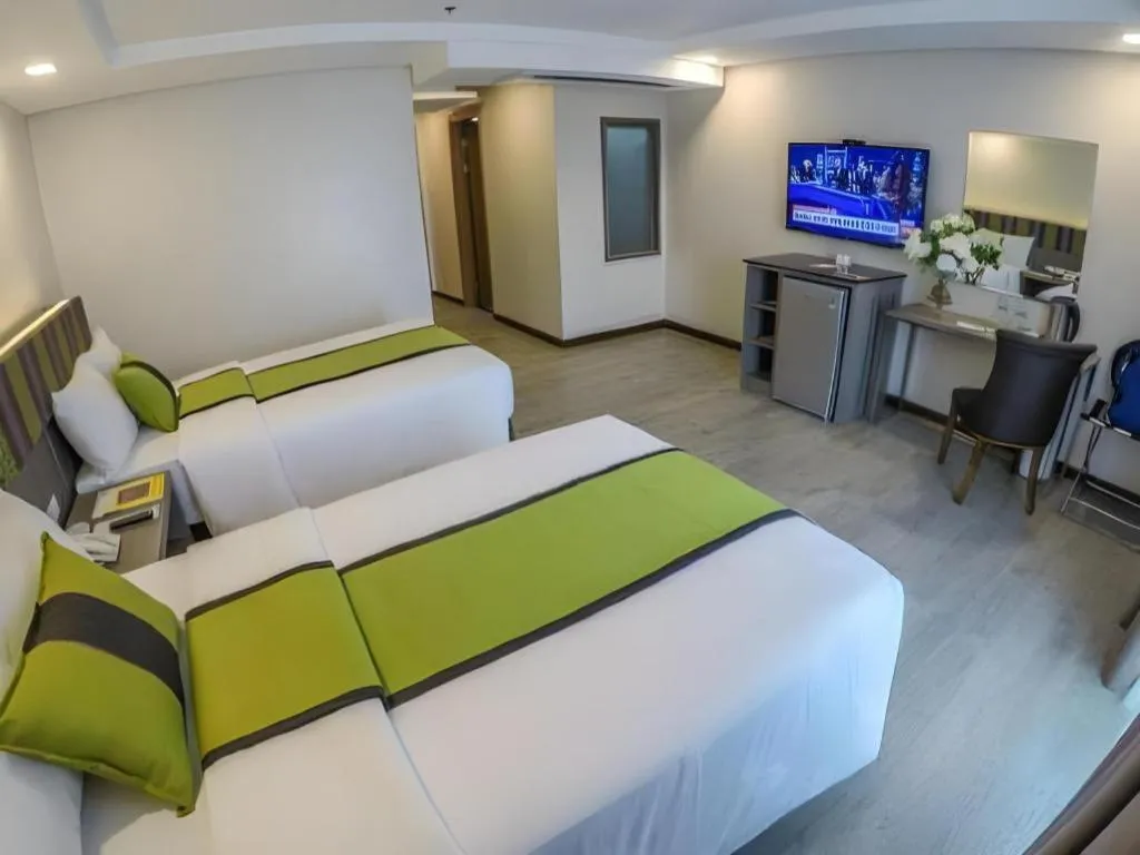 Bed in Grand Xing Imperial Hotel