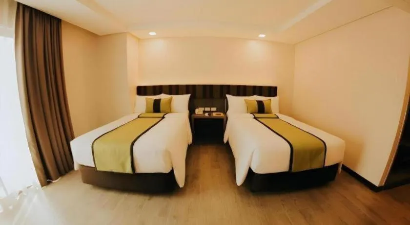 Bed in Grand Xing Imperial Hotel