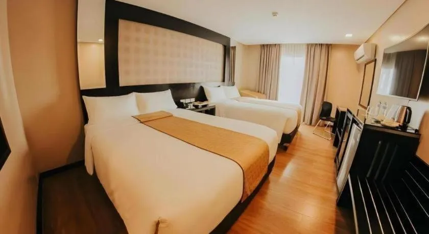 Bed in Grand Xing Imperial Hotel