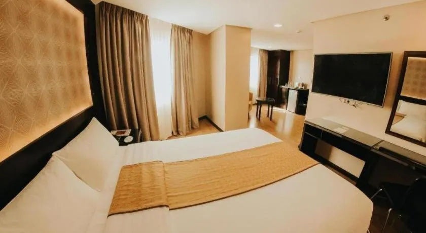 Bed in Grand Xing Imperial Hotel