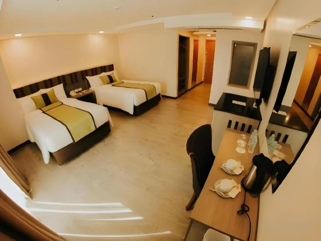 Bed in Grand Xing Imperial Hotel