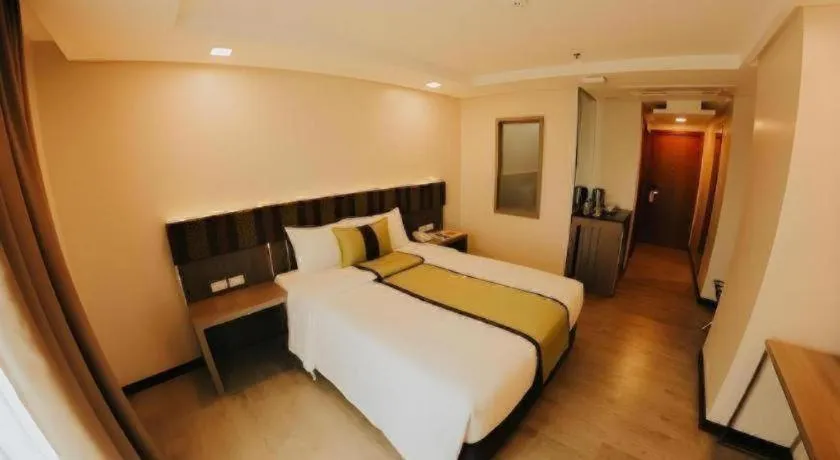 Bed in Grand Xing Imperial Hotel