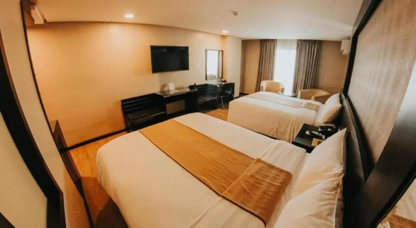 Bed in Grand Xing Imperial Hotel