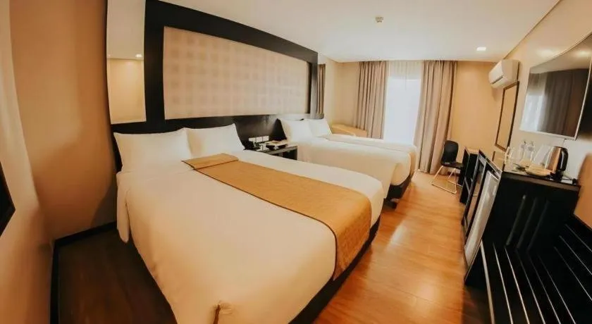 Bed in Grand Xing Imperial Hotel