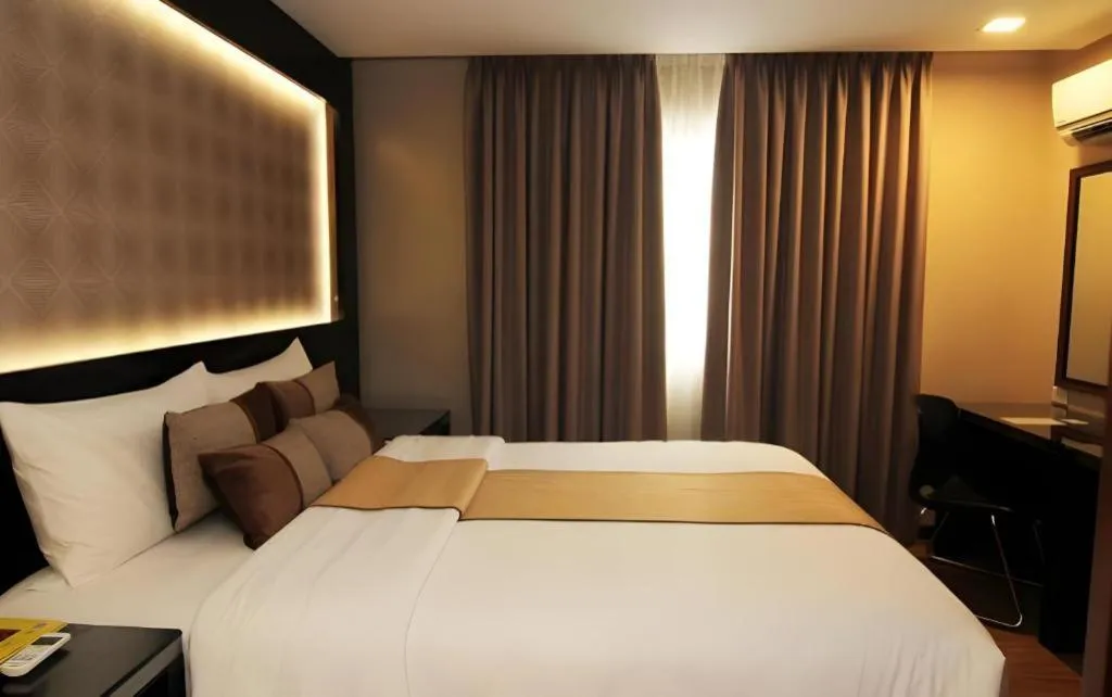 Bed in Grand Xing Imperial Hotel