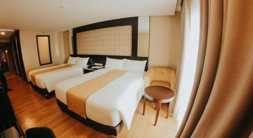 Bed in Grand Xing Imperial Hotel