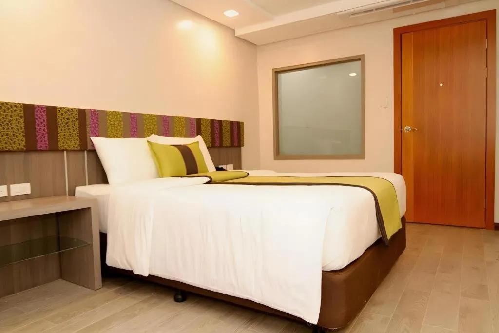 Bed in Grand Xing Imperial Hotel