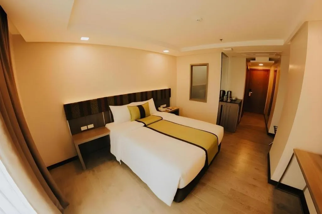 Bed in Grand Xing Imperial Hotel