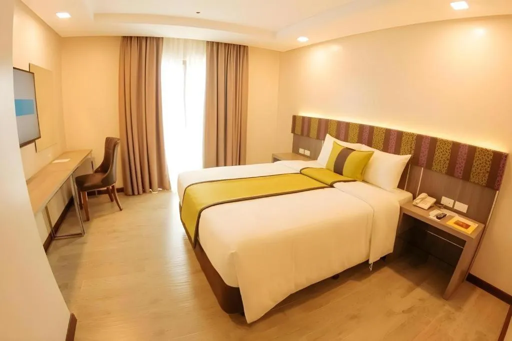 Bed in Grand Xing Imperial Hotel