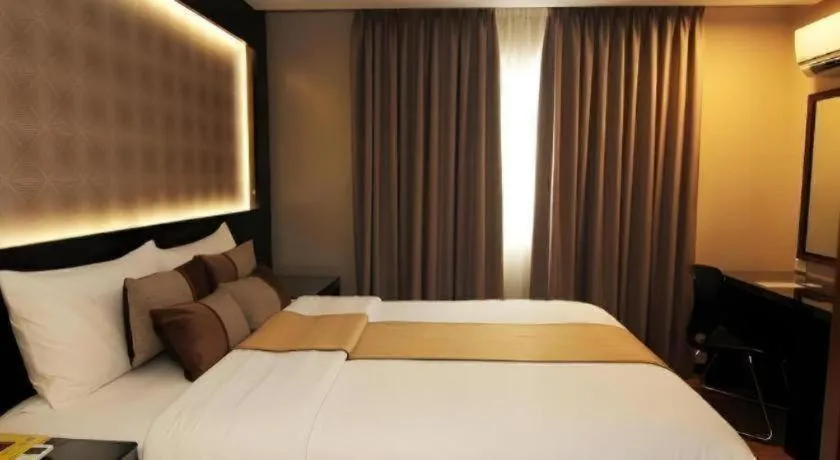 Bed in Grand Xing Imperial Hotel