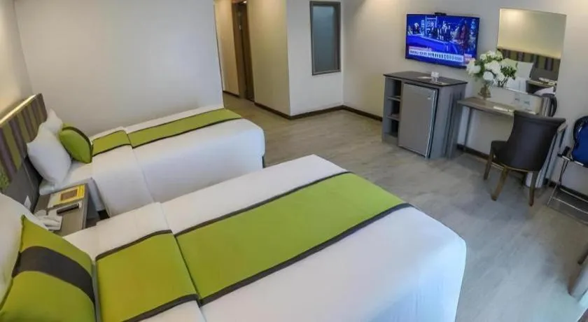 Bed in Grand Xing Imperial Hotel