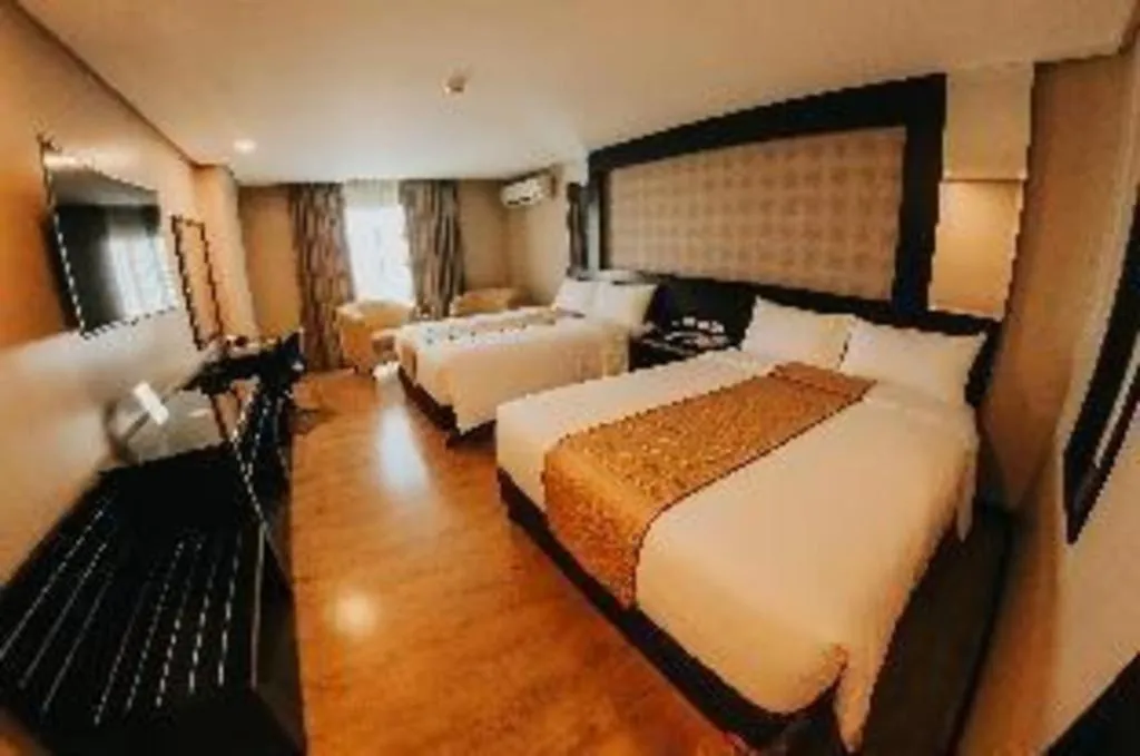 Bed in Grand Xing Imperial Hotel