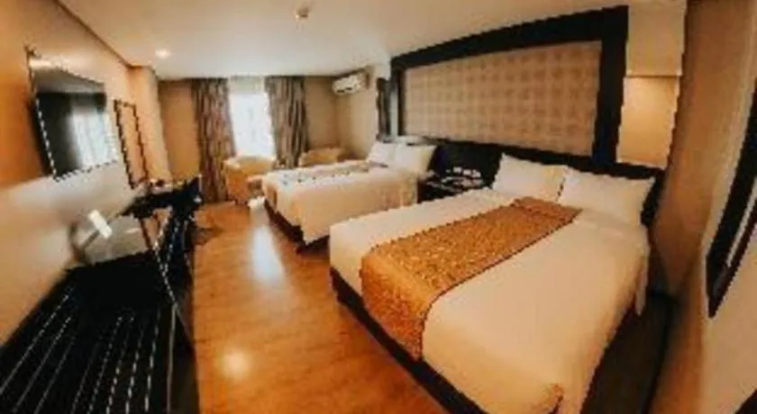 Bed in Grand Xing Imperial Hotel