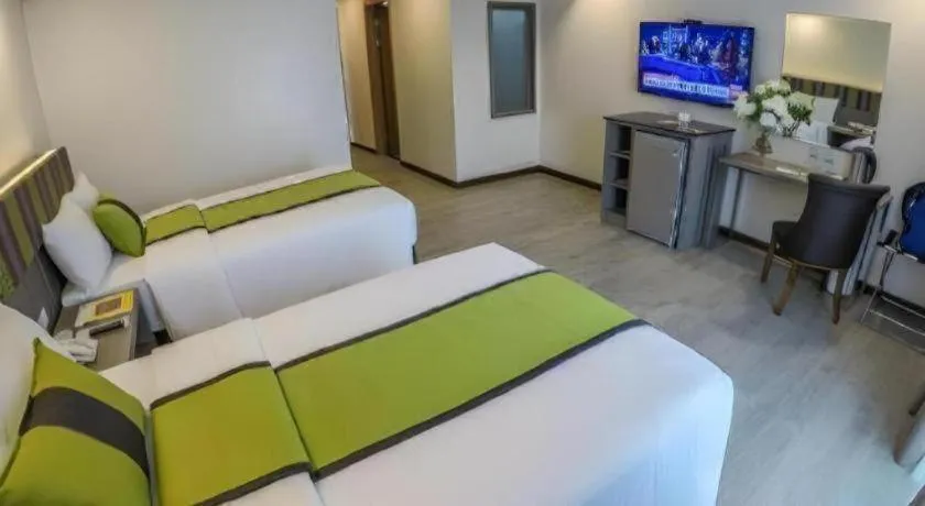 Bed in Grand Xing Imperial Hotel