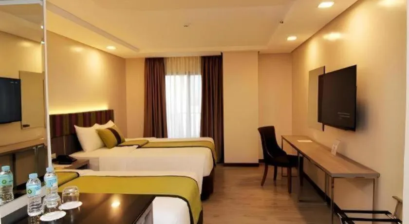 Bed in Grand Xing Imperial Hotel