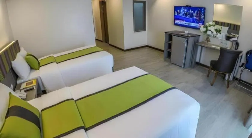 Bed in Grand Xing Imperial Hotel