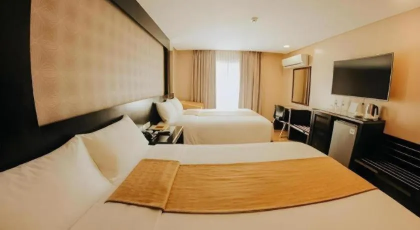 Bed in Grand Xing Imperial Hotel