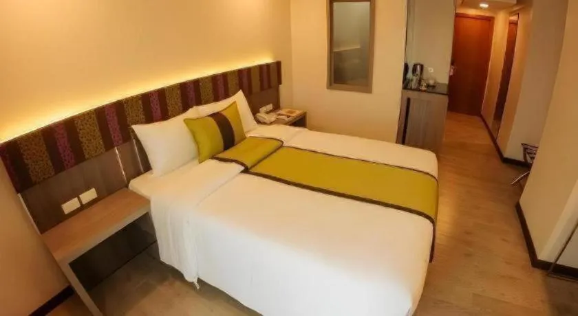 Bed in Grand Xing Imperial Hotel