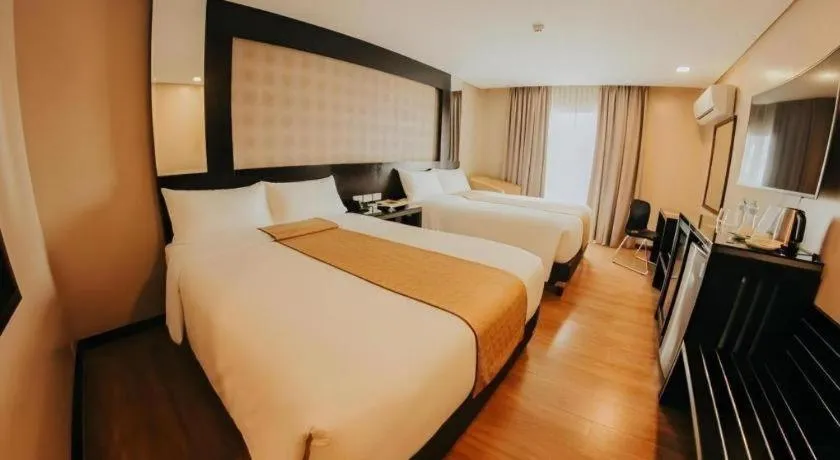 Bed in Grand Xing Imperial Hotel