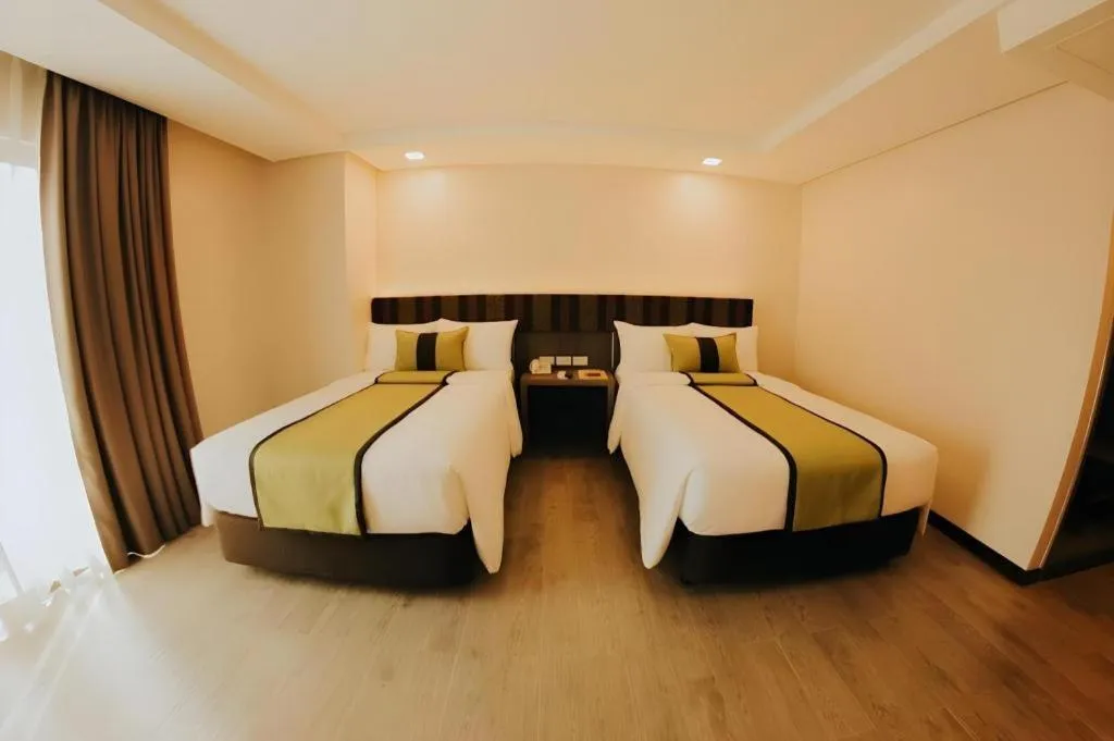 Bed in Grand Xing Imperial Hotel