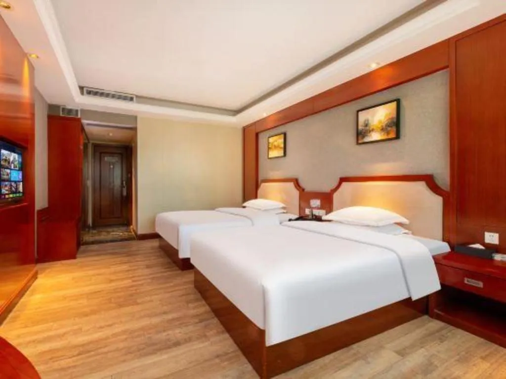 Bed in Borrman Hotel Guangzhou Tianhe Tangdong Subway Station Convention and Exhibition Center