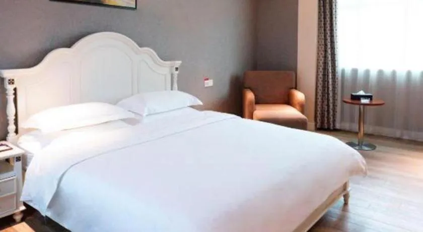 Bed in Borrman Hotel Guangzhou Tianhe Tangdong Subway Station Convention and Exhibition Center