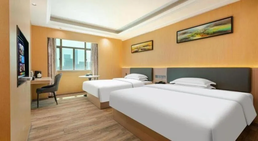 Bed in Borrman Hotel Guangzhou Tianhe Tangdong Subway Station Convention and Exhibition Center