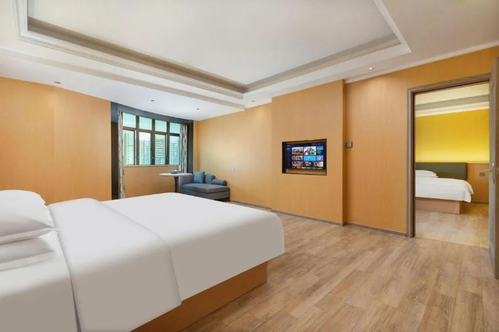 Bed in Borrman Hotel Guangzhou Tianhe Tangdong Subway Station Convention and Exhibition Center