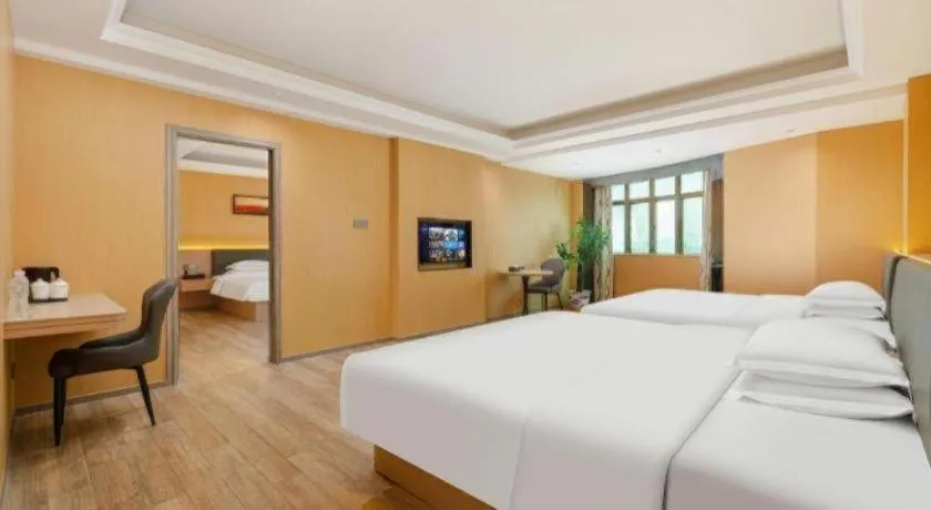 Bed in Borrman Hotel Guangzhou Tianhe Tangdong Subway Station Convention and Exhibition Center