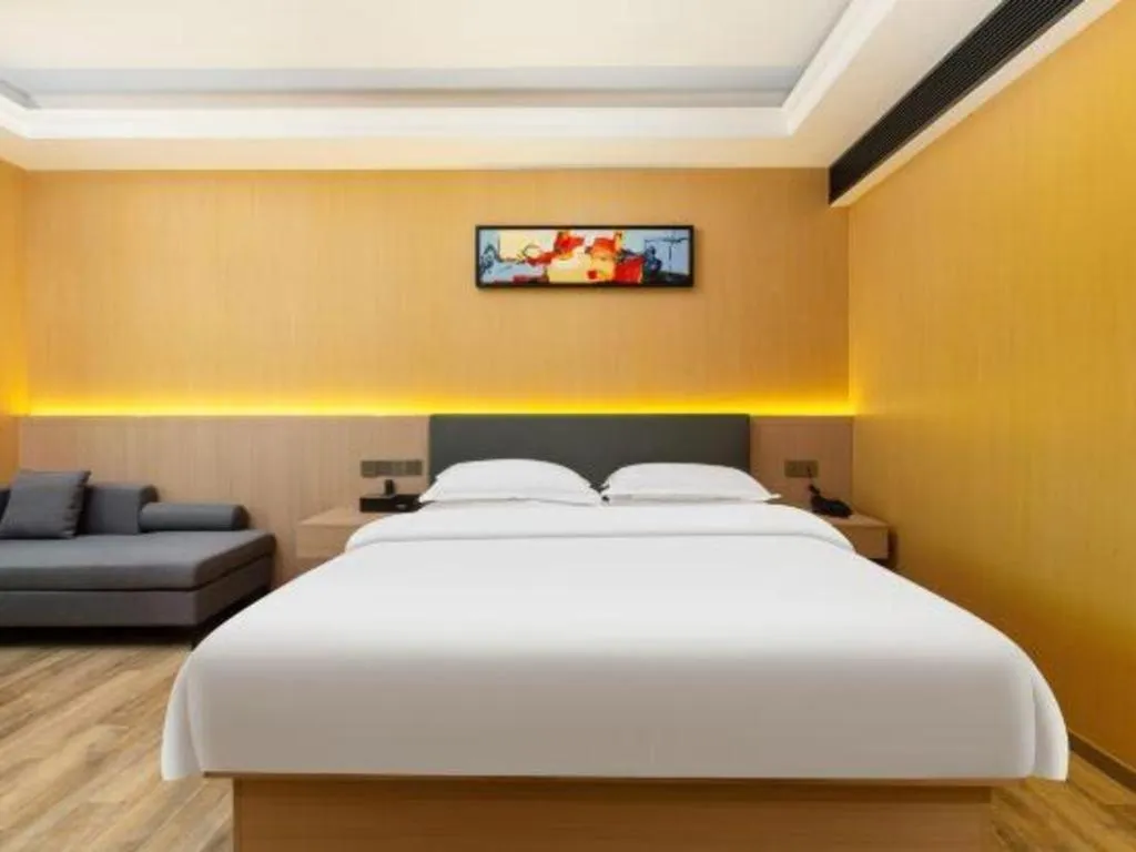 Bed in Borrman Hotel Guangzhou Tianhe Tangdong Subway Station Convention and Exhibition Center