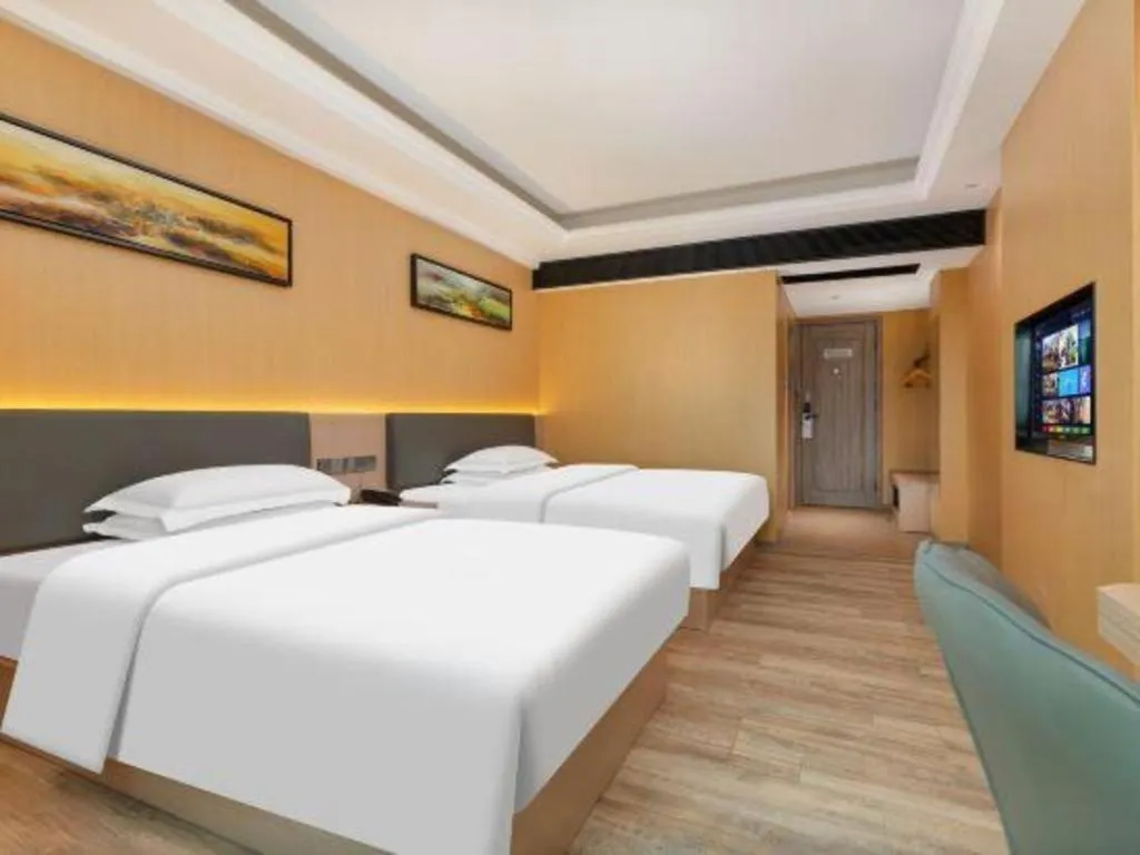 Bed in Borrman Hotel Guangzhou Tianhe Tangdong Subway Station Convention and Exhibition Center