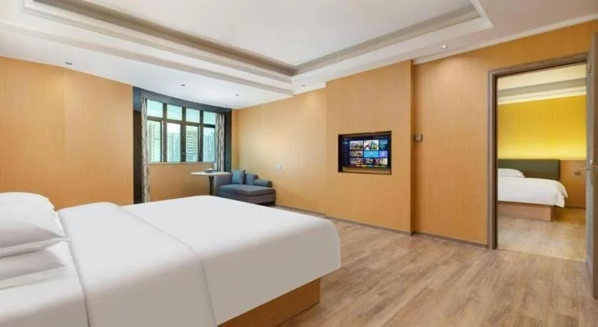 Bed in Borrman Hotel Guangzhou Tianhe Tangdong Subway Station Convention and Exhibition Center