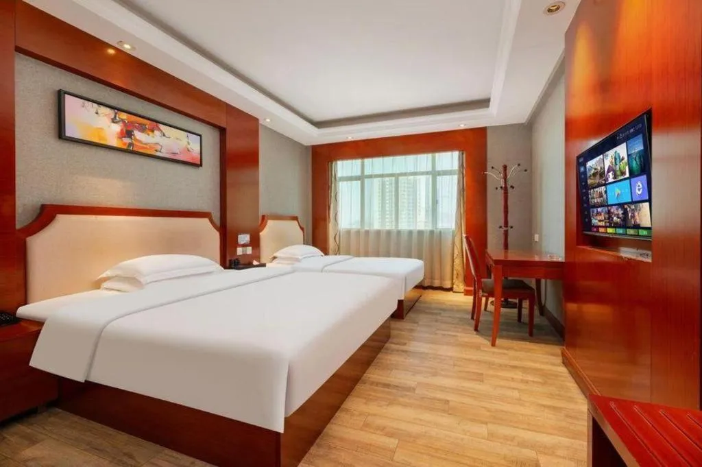 Bed in Borrman Hotel Guangzhou Tianhe Tangdong Subway Station Convention and Exhibition Center