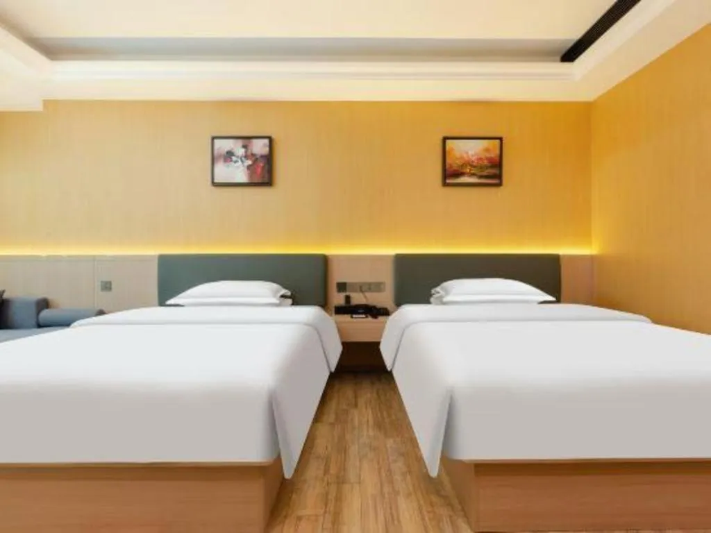 Bed in Borrman Hotel Guangzhou Tianhe Tangdong Subway Station Convention and Exhibition Center
