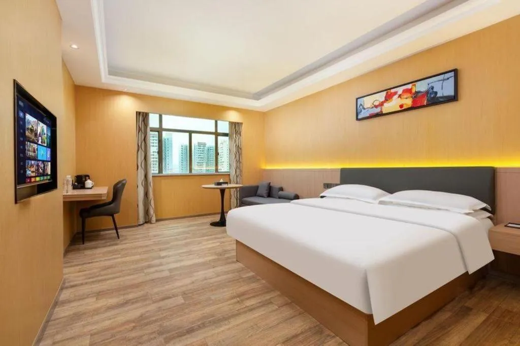 Bed in Borrman Hotel Guangzhou Tianhe Tangdong Subway Station Convention and Exhibition Center