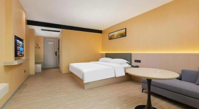 Bed in Borrman Hotel Guangzhou Tianhe Tangdong Subway Station Convention and Exhibition Center