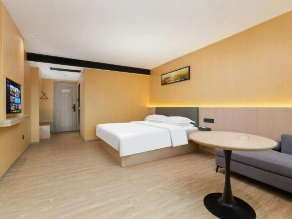 Bed in Borrman Hotel Guangzhou Tianhe Tangdong Subway Station Convention and Exhibition Center