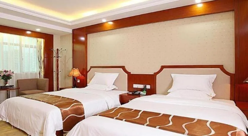 Bed in Borrman Hotel Guangzhou Tianhe Tangdong Subway Station Convention and Exhibition Center
