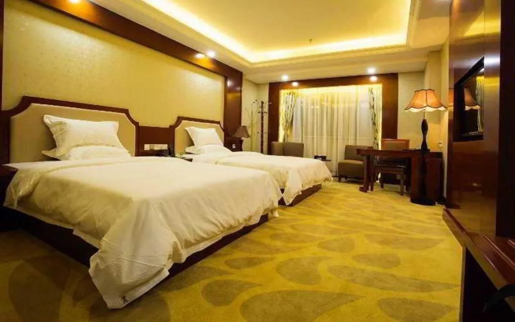Bed in Borrman Hotel Guangzhou Tianhe Tangdong Subway Station Convention and Exhibition Center